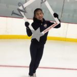 Willowbrook Ice Arena youth figure skater holding up Willowbrook frame